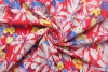 Хлопок-жаккард стрейч Dolce&Gabbana жёлтые, синие цветы на красном фоне фото в интернет-магазине Ауратессу